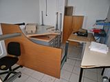 an image of a kitchen with a desk and a chair