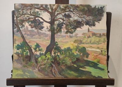 un tableau posé sur un chevalet, sur lequel est représenté un autre tableau