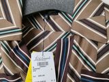 a close up of a shirt with a tag on a hanger
