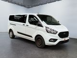 the white van is parked in a large room