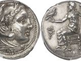 a silver coin with an image of a man and a woman on it
