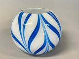 a blue and white vase sitting on a table