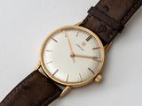 an image of a close up of a wrist watch on a white surface