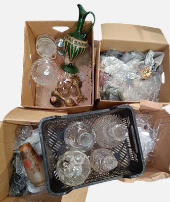 two boxes with glass items in them sitting on a table