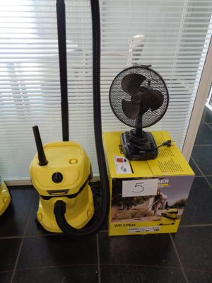 two vacuums that are sitting on the floor next to each other