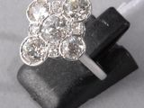 an image of a close up of a diamond ring on a rock