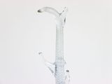 a glass giraffe that is sitting on a table