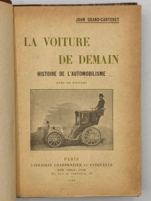 un vieux livre sur lequel figure la photo d'un homme assis dans une voiture