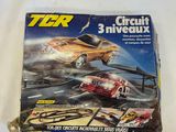 a close up of a box of toy cars on a white surface