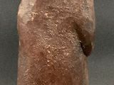 a small statue of a man with a hat on his head