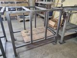 a metal frame in the middle of a work area