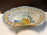 a bowl with a picture of a house on it