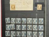 a picture of a collection of stamps on display in a glass case