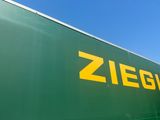 a large green truck with a yellow zieg logo on it