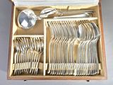 a wooden box with silverware in it on a table