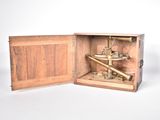 a small wooden box with a telescope inside of it