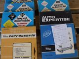 several boxes of car parts are sitting on a wooden table