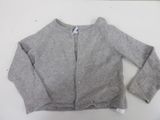grey cardigan sweater on a white table