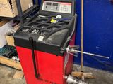 an image of a machine in a garage with tools