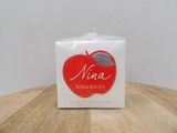 a box of nina nina rico on a wooden table