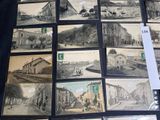 a lot of old postcards that are on the table