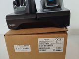 two remotes sitting on top of a box on a table