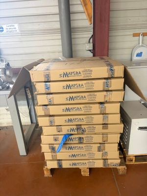 several boxes stacked on top of each other in a warehouse