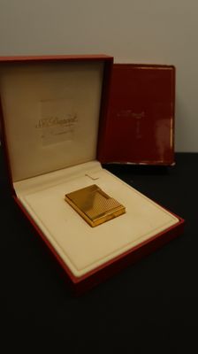 an image of a gold plated cigarette case in a red box