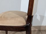 a chair that has a cushion on the back of it
