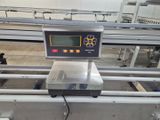 an image of a weighing machine in a factory