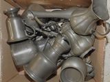 a cardboard box full of old metal items that are in it