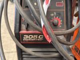 a close up view of a welding machine with wires