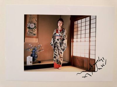 signed photograph of a geisha woman in a traditional kimono