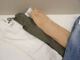 three pairs of pants that are sitting on a table