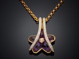 an amethorate and diamond pendant on a gold chain