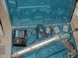 a blue tool box with a wren and a hammer inside of it