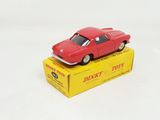 a red toy car sitting on top of a yellow box