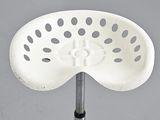 an image of a white stool with holes on it