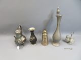 five different types of vases on the table