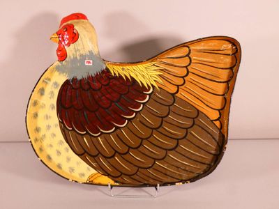 a decorative turkey that is sitting on a stand