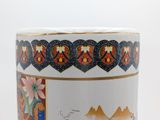a close up of a vase with a picture on it