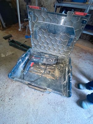 a tool box with tools inside of it on the floor