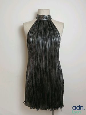 a black leather dress with fringes on a mannequin mannequin mannequin mannequin mannequin mannequin mannequin manne