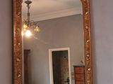 a mirror that is on a dresser in a room