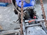 a motorcycle with a chain attached to it ' s back
