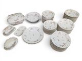 a lot of plates that are sitting on a table