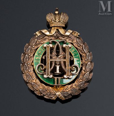 a close up of a badge with a crown on top of it