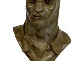 statue of a cat wearing a collared shirt on a black base