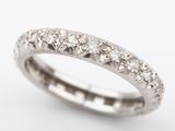 a close up of a diamond ring on a white background