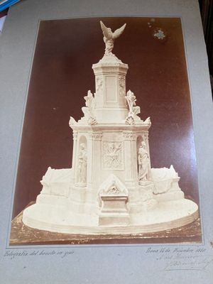 a picture of a statue of a bird on top of a building